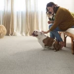 Lady playing with dog | Reinhold Flooring