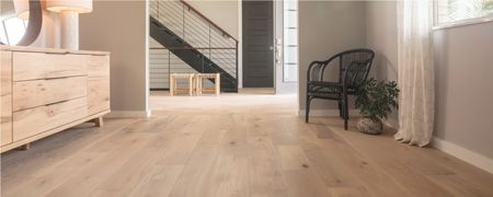 Light wood flooring in a modern home hallway and living space | Reinhold Flooring